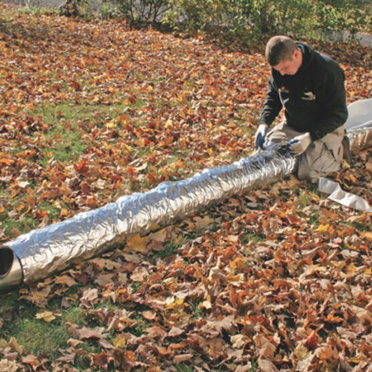 All Fabrications Super Wrap 1/2" foil-face insulation blanket wrapped on a chimney liner (INW-1236F)