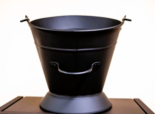ComfortBilt ash bucket with lid next to a ComfortBilt pellet stove