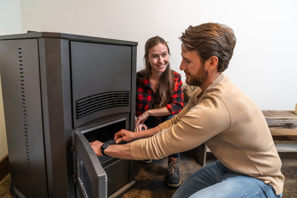 ComfortBilt Alpine HP42 pellet stove – Black, couple relaxing beside the stove