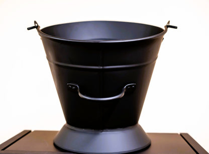 ComfortBilt ash bucket with lid next to a ComfortBilt pellet stove