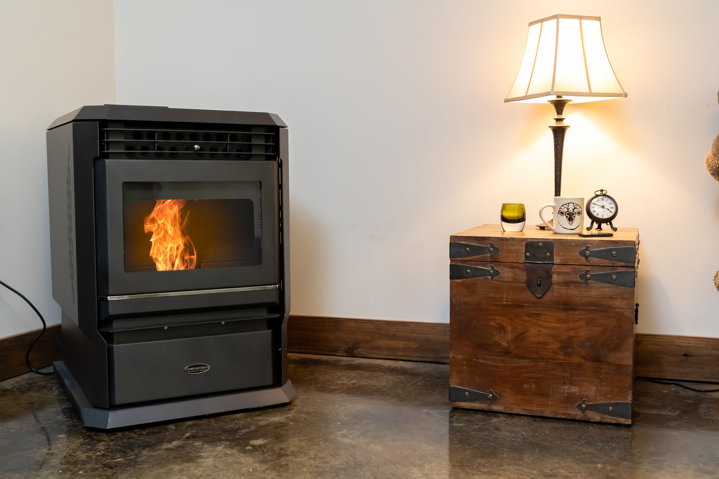 ComfortBilt HP61 pellet stove in Black — corner basement
