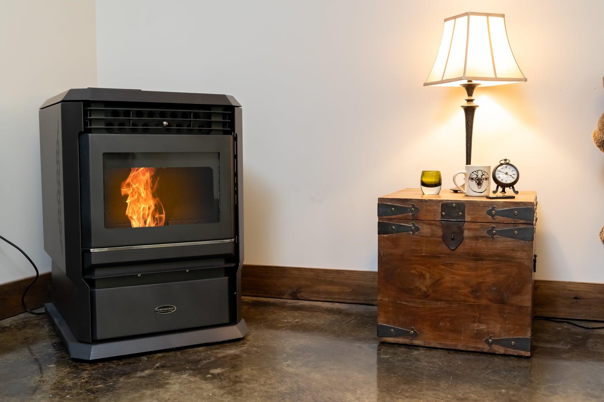 ComfortBilt HP61 pellet stove in Black — corner basement