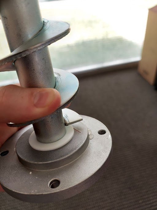ComfortBilt auger PTFE washer installed on a ComfortBilt pellet stove auger